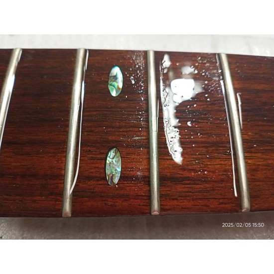 Guitar fretboard  treatment with linseed oil